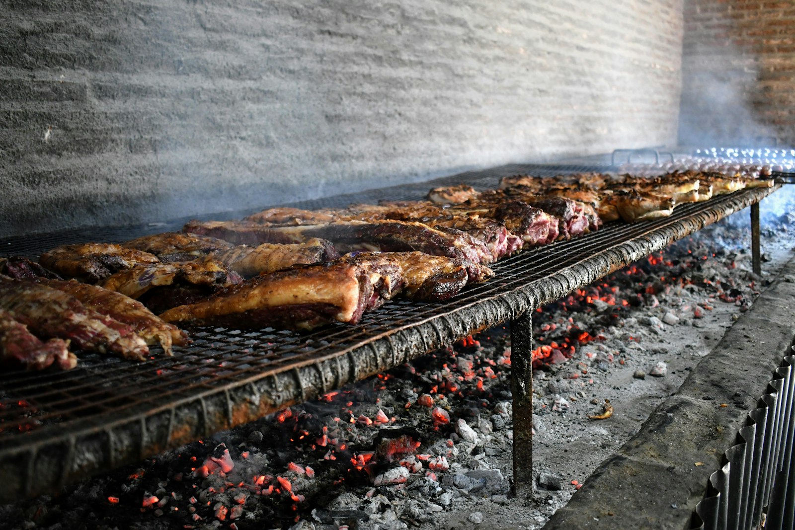 Meat grilling over hot coals