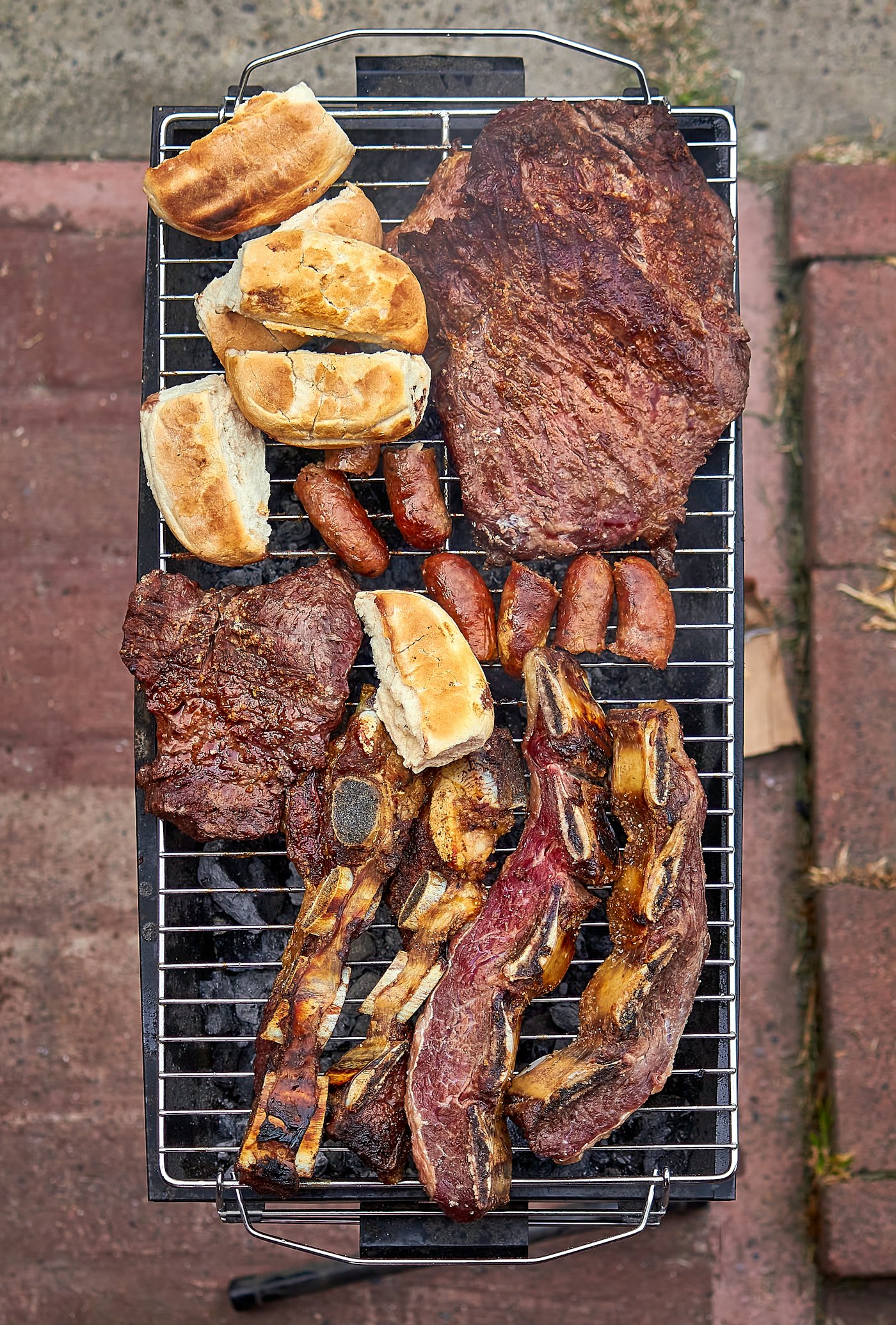 Argentine asado with mixed meats over fire