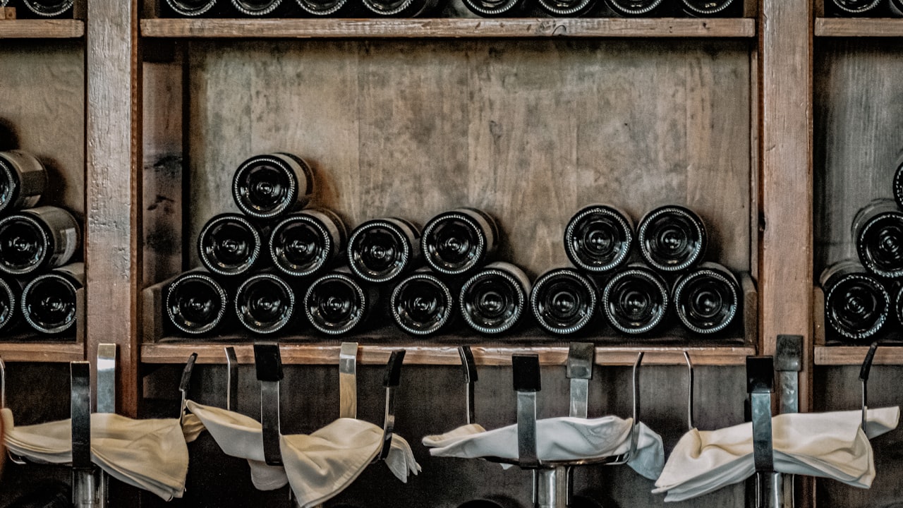Rows of champagne bottles aging in a cellar