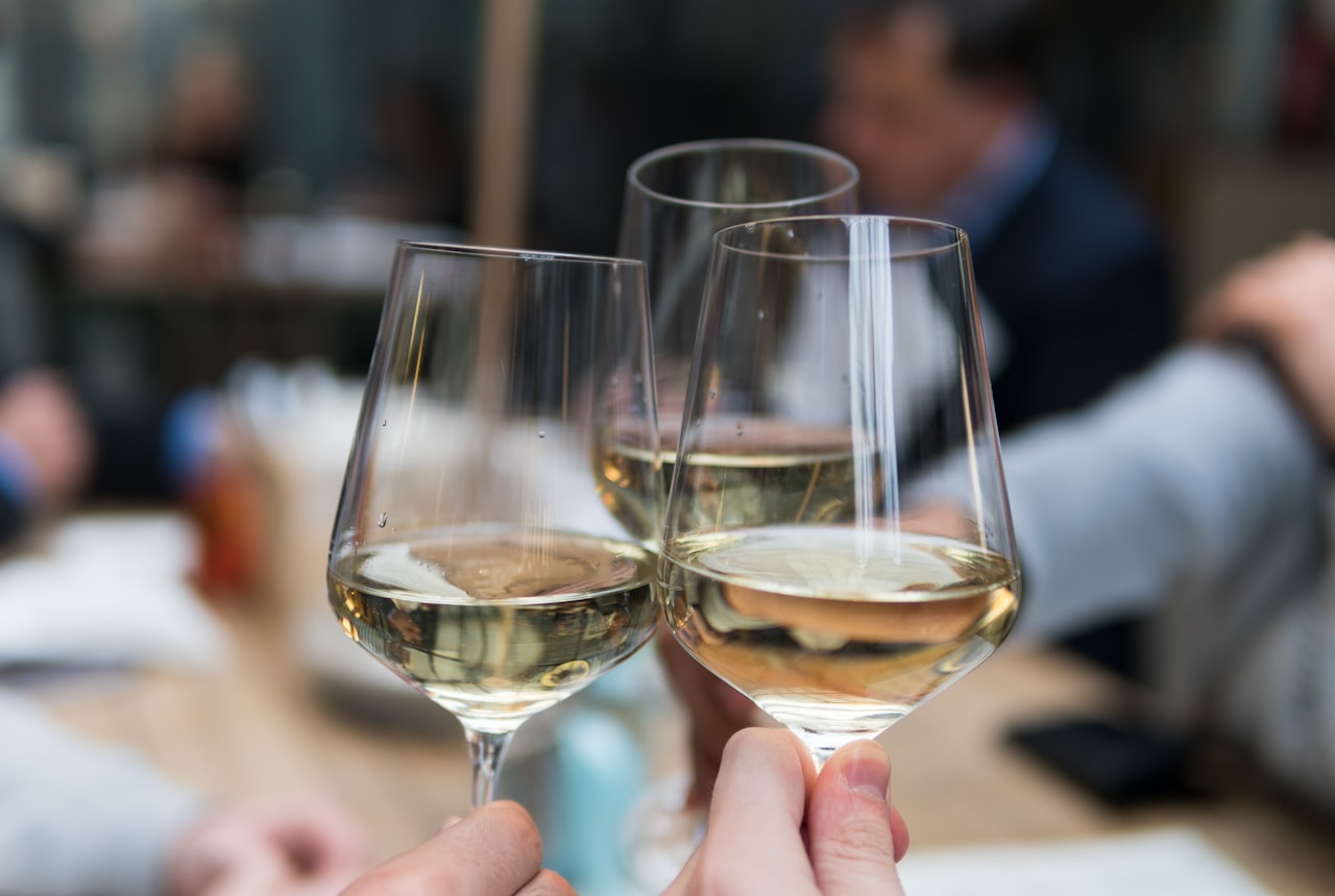 Two glasses of white wine side by side for comparison