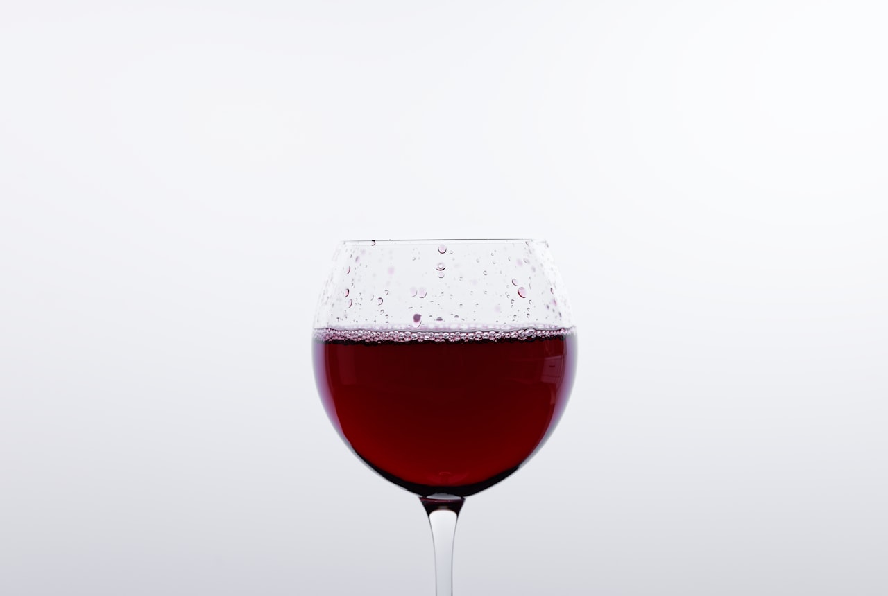 A glass of cloudy, unfiltered natural wine