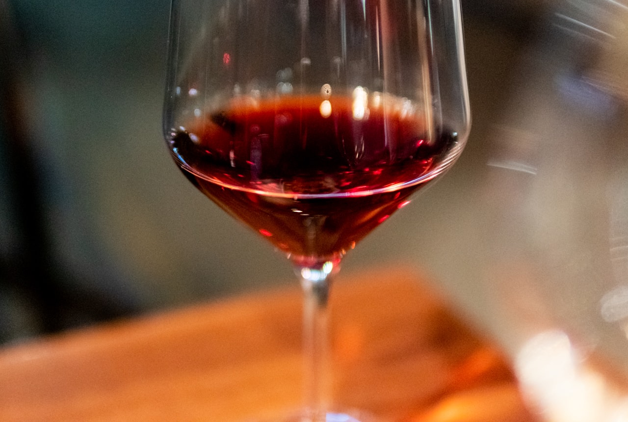 A glass of pale, translucent ruby-red Pinot Noir